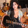 Amy holding a guitar